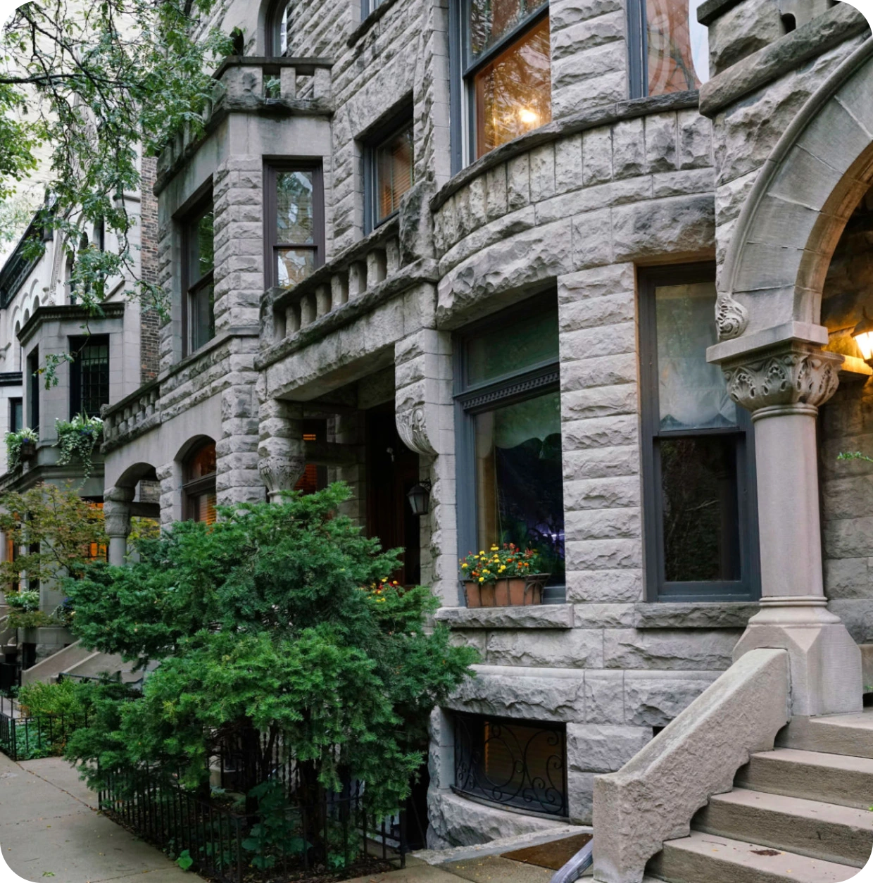 Historic stone building with arched windows.