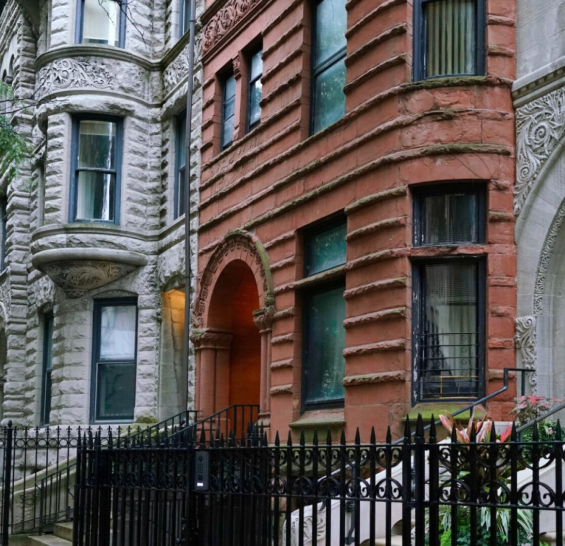 Historic stone and brick residential buildings facade.